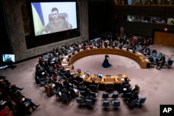 Ukrainian President Volodymyr Zelenskyy speaks via remote feed during a meeting of the UN Security Council, April 5, 2022, at United Nations headquarters in New York. (AP Photo/John Minchillo)