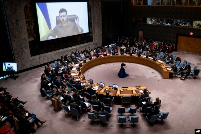 Ukrainian President Volodymyr Zelenskyy speaks via remote feed during a meeting of the UN Security Council, April 5, 2022, at United Nations headquarters in New York. (AP Photo/John Minchillo)