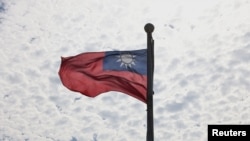 FILE - A Taiwanese flag flaps in the wind in Taoyuan, Taiwan, June 30, 2021. 