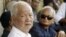 Former Khmer Rouge leaders Khieu Samphan, left, and Nuon Chea, right, look on during the funeral for Khieu Ponnary, the first wife of Khmer Rouge leader Pol Pot, in 2003. 