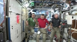 Joe Acaba, left, the first astronaut of Puerto Rican heritage, talks during an interview alongside Italy's Paolo Nespoli, center, and American Mark Vande Hei from the International Space Station on Sept. 20, 2017. Acaba offered words of comfort to Puerto