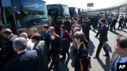 South Korean delegation members arrive at the Pyongyang Airport in Pyongyang, North Korea, Oct. 4, 2018. The delegation flew to North Korea Thursday for a joint celebration of the anniversary of a 2007 summit and to possibly hold further peace talks.