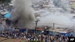 FILE - Kenya post-election rioting can be seen in this Dec. 31, 2007, photo. Some say next year's election could reignite rivalries, if Deputy President William Ruto decides to run against incumbent Uhuru Kenyatta.