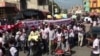 Journalists in Haiti and their supporters take to the streets of Port-au-Prince, Jan. 28, 2021, to protest against police brutality. (Photo: Matiado Vilme / VOA) 