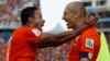 Netherlands' Memphis Depay, left, celebrates with teammate Arjen Robben after scoring his side's second goal during the group B World Cup soccer match between the Netherlands and Chile at the Itaquerao Stadium in Sao Paulo, June 23, 2014.