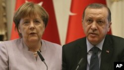 From left, German Chancellor Angela Merkel and Turkish President Recep Tayyip Erdogan.