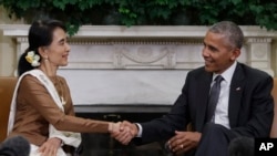 FILE - President Barack Obama and Myanmar's leader Aung San Suu Kyi shake hands as they speak to media at the conclusion of a meeting in the Oval Office of the White House in Washington, Wednesday, Sept. 14, 2016. (AP Photo/Carolyn Kaster)