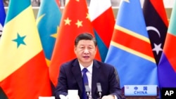 FILE - In this photo released by Xinhua News Agency, Chinese President Xi Jinping speaks at the Forum on China-Africa Cooperation (FOCAC) via video link in Beijing on Nov. 29, 2021.