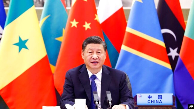 FILE - In this photo released by Xinhua News Agency, Chinese President Xi Jinping speaks at the Forum on China-Africa Cooperation (FOCAC) via video link in Beijing on Nov. 29, 2021.