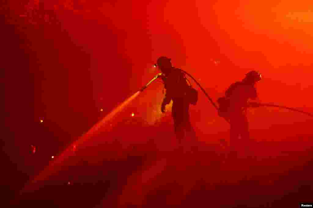 Firefighters work as the Mosquito Fire burns in Foresthill, California, Sept. 13, 2022.