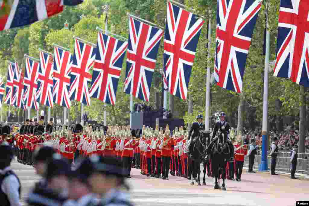 Royal guards march on the day the coffin of Britain's Queen Elizabeth is transported from Buckingham Palace to the Houses of Parliament for her lying in state, in London, Sept. 14, 2022.
