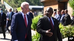FILE - U.S. President Joe Biden speaks with South Africa President Cyril Ramaphosa during a G-7 summit in Cornwall, England, June 12, 2021.