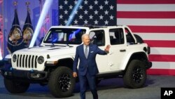 President Joe Biden arrives to speak at the North American International Auto Show in Detroit, Michigan, Sept. 14, 2022.