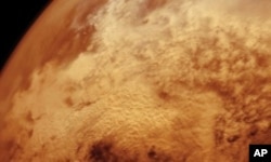 This image of a global sandstorm on Mars was pieced together from dozens of individual frames taken from the Viking orbiter of the late 1970s and early 1980s.