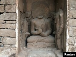 Statues are seen after being discovered and unveiled to the public, during a ceremony at the Buddhist-period archeological site near Haripur, in Khyber Pakhtunkhwa (KPK) province, Pakistan, Nov. 15, 2017.