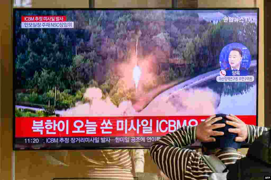 A man watches a television showing a news broadcast of a North Korean missile test, at a railway station in Seoul. A suspected intercontinental ballistic missile launched by North Korea on Nov. 18 is believed to have fallen in Japan&#39;s exclusive economic waters, Japanese Prime Minister Fumio Kishida said.