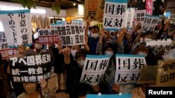 Protesters attend a rally against Japan's state funeral for former Prime Minister Shinzo Abe that will be held next Tuesday in Tokyo, Japan, Sept. 25, 2022. 