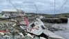 A sailboat lies washed up on shore following after the area was hit by Hurricane Fiona, in Shearwater, Nova Scotia, Canada, Sept. 24, 2022.