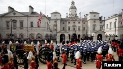 The coffin of Queen Elizabeth is transported in London, Sept. 19, 2022.