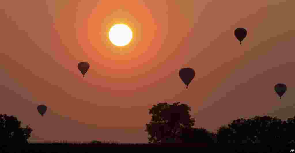 Hot air balloons dot the early morning sky just after taking off near Bird-in-Hand, Pennsylvania.