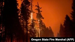 The Cedar Creek wildfire rages out of control in Oregon, Sept. 13, 2022, as residents face evacuation orders and worsening air quality as multiple blazes scorch the U.S. West. 