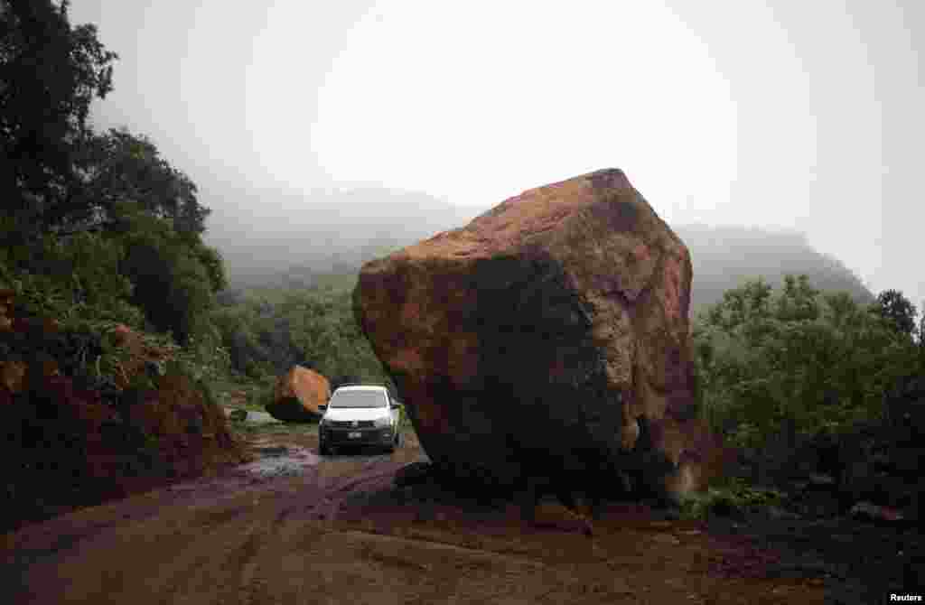 Boulders are pictured blocking a road after an earthquake on Monday, in Ojo de Agua, Michoacan, Mexico, Sept. 20, 2022.