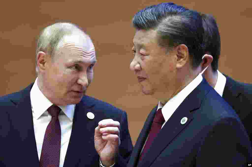 Russian President Vladimir Putin, left, gestures while speaking to Chinese President Xi Jinping during the Shanghai Cooperation Organization (SCO) summit in Samarkand, Uzbekistan.