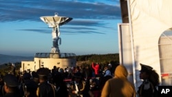 FILE - People attend the launch of Ethiopia's first micro-satellite (ETRSS-1) at the Entoto Observatory on the outskirts of the capital Addis Ababa, Dec. 20, 2019. Ethiopia's first-ever satellite has been launched into space by China.