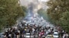 FILE - In this photo obtained by the AP outside Iran, protesters chant slogans during a protest over the death of a woman detained by the morality police, in Tehran, Iran, Sept. 21, 2022.