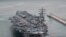 U.S. aircraft carrier USS Ronald Reagan and its battle group launched drills with South Korean warships off the Korean Peninsula’s east coast on Sept. 26, 2022
