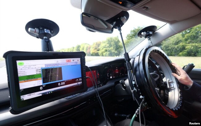 AB Dynamics Application Engineer Hadyn Kiff, gives a demonstration of the Emergency Steering Support (ESS) system. (REUTERS/Matthew Childs)