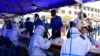 FILE - People queue to undergo nucleic acid tests for COVID-19 in Lhasa, in China's western Tibet Autonomous Region, Aug. 9, 2022.