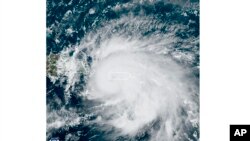 This satellite image provided by the US National Oceanic and Atmospheric Administration (NOAA) shows Hurricane Fiona on Sunday, September 18, 2022, in the Caribbean.