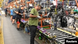 FILE: Engines assembled as they make their way through the assembly line at the General Motors (GM) manufacturing plant in Spring Hill, Tennessee, U.S. August 22, 2019. Picture taken August 22, 2019. 