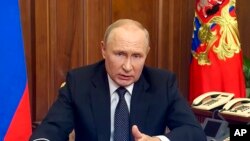 Presiden Rusia Vladimir Putin menyampaikan pidato publik dari Moskow, Rusia, pada 21 September 2022. (Foto: Russian Presidential Press Service via AP)