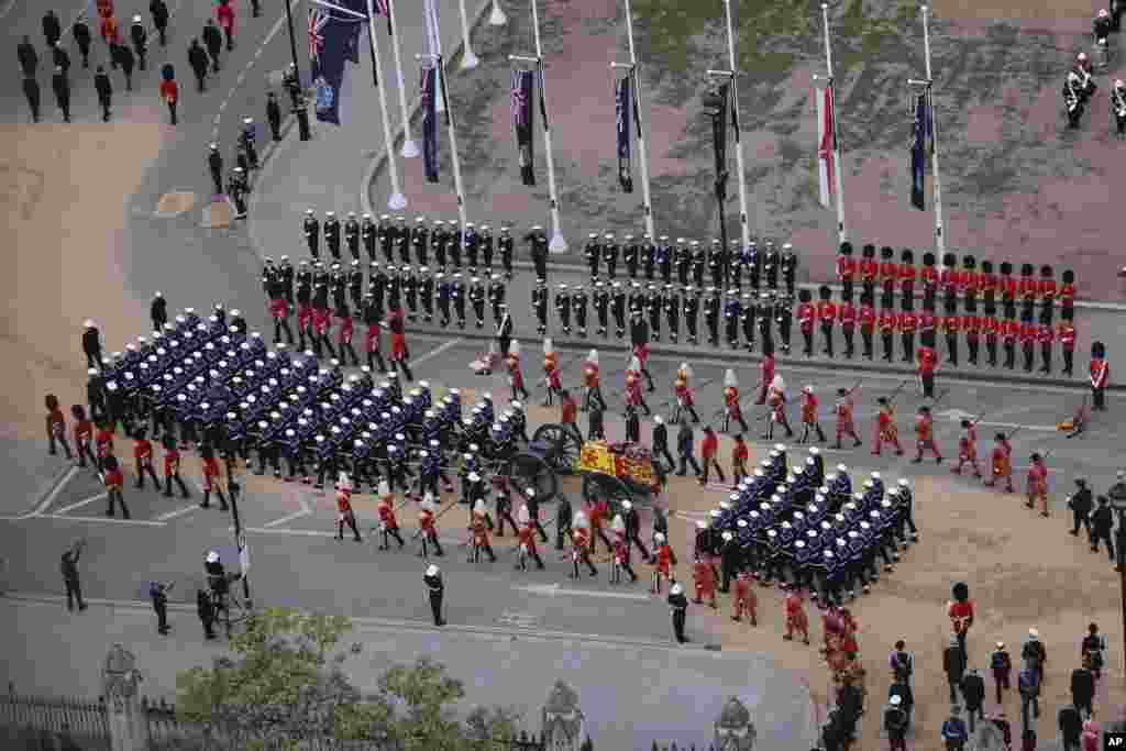 Members of the armed forces march during the funeral procession for Queen Elizabeth II from Westminster Hall to London&rsquo;s historic Westminster Abbey.