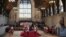 The King's Body Guards of the Honourable Corps of Gentlemen at Arms, the Life Guards, the Blues and Royals and Yeomen of the Guard, stand guard around the coffin of Queen Elizabeth II, inside Westminster Hall, at the Palace of Westminster, in London, Sept