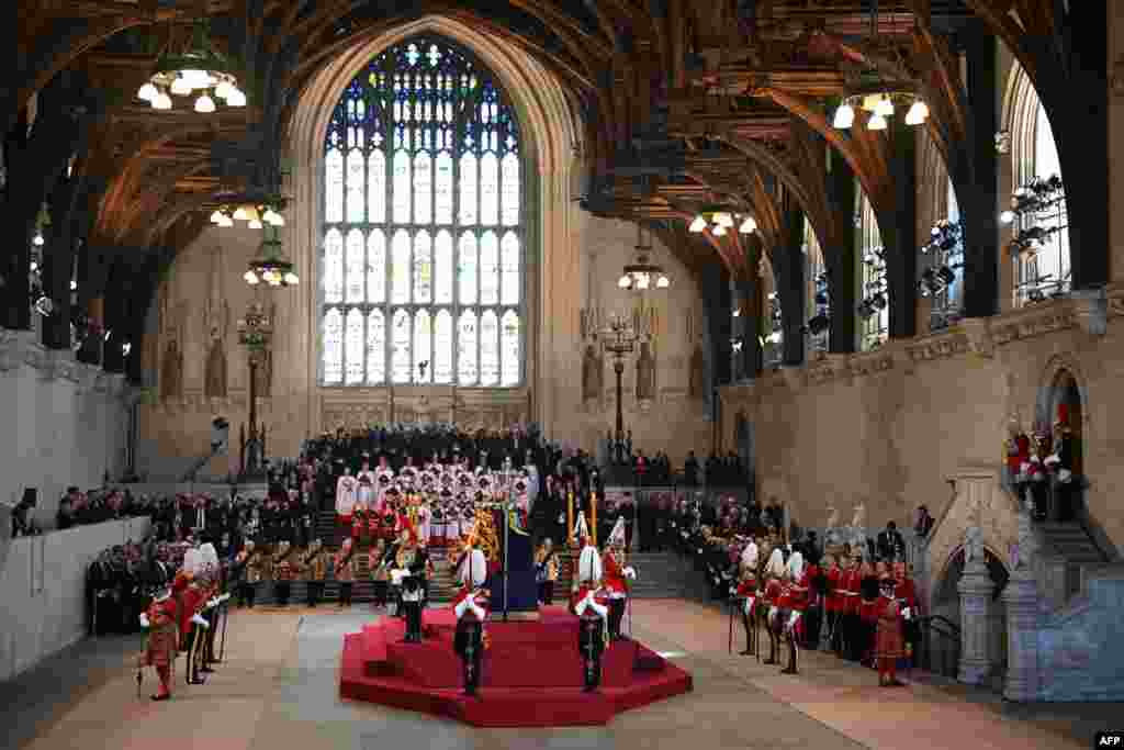 The King&#39;s Body Guards of the Honorable Corps of Gentlemen at Arms, the Life Guards, the Blues and Royals and Yeomen of the Guard, stand guard around the coffin of Queen Elizabeth II, inside Westminster Hall, at the Palace of Westminster, in London,&nbsp;where it will Lie in State on a Catafalque.