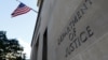 FILE - Signage is seen at the United States Department of Justice headquarters in Washington, Aug. 29, 2020. 