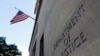 FILE - Signage is seen at the United States Department of Justice headquarters in Washington, Aug. 29, 2020. 