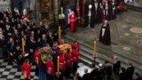 The coffin is placed near the altar at the State Funeral of Queen Elizabeth II, held at Westminster Abbey, London, Sept. 19, 2022. 