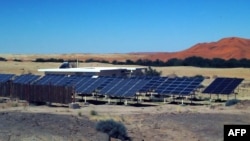 FILE - This solar electicity hybrid system is situated at the Gobabeb desert research station in the Namib Desert, Namibia. The nation has high hopes for its ability to produce "green hydrogen" from natural resources like wind and sun, both of which it ha