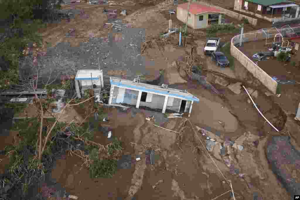 A house is seen in the mud after it was washed away by Hurricane Fiona at Villa Esperanza in Salinas, Puerto Rico, Sept. 21, 2022.