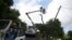 FILE - Workers of Puerto Rico's Electric Power Authority (PREPA) repair part of the electrical grid as the island's fragile power system is still reeling from the devastation wrought by Hurricane Maria, in Utuado, Puerto Rico May 17, 2018. 