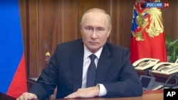 En esta imagen tomada de un video distribuido por el servicio de prensa de la presidencia de Rusia, el presidente, Vladimir Putin, se dirige a la nación, en Moscú, Rusia, el 21 de septiembre de 2022. (Servicio de Prensa de la Presidencia de Rusia vía AP)