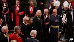 U.S. President Joe Biden and first lady Jill Biden arrive at the Westminster Abbey on the day of Queen Elizabeth II funeral, in London, Sept. 19, 2022. 