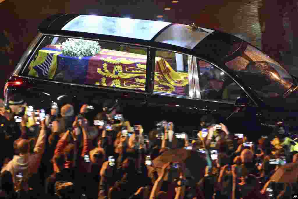 The coffin of Queen Elizabeth in the royal hearse travels to Buckingham Palace in London, Sept. 13, 2022. 