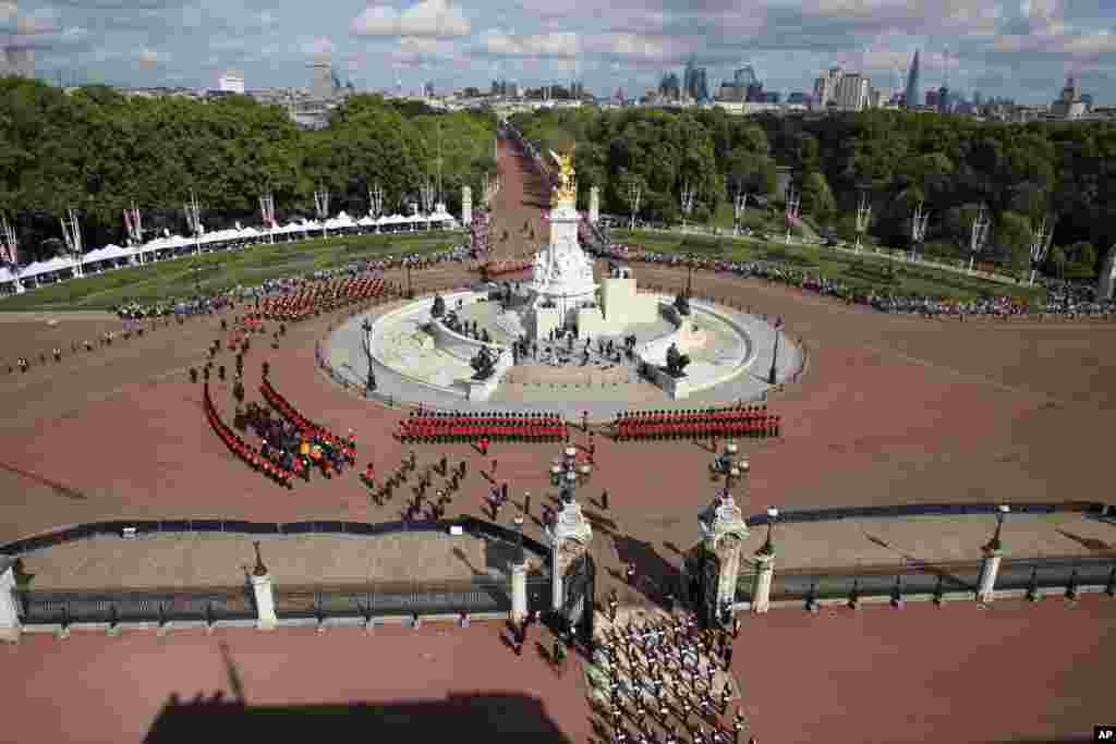 The coffin of Queen Elizabeth II, adorned with a Royal Standard and the Imperial State Crown, is moved from Buckingham Palace to Westminster Hall in London, Sept. 14, 2022.