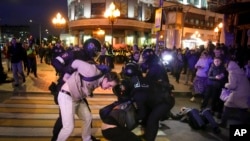 FILE - Riot police detain demonstrators during a protest against mobilization in Moscow, Russia, Wednesday, Sept. 21, 2022.