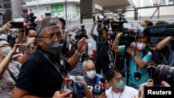 Ronson Chan, chairman of the Hong Kong Journalists Association (HKJA), reports to police over his charge of obstructing police, in Hong Kong, China Sept. 19, 2022. 